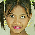 Asian cutie in pig tails gets naked