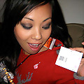 Pictures of an Oriental tease posing sexy in a party